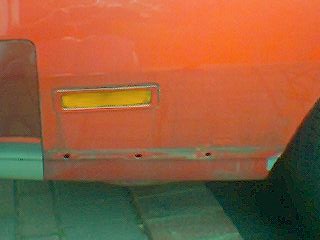 028image_00065 The holes are where the skirts were removed, the U.S. name for skirts is 