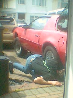 029image_00075 Nick with his head up the exhaust pipe of my car = well not quite - 10th Aug 04